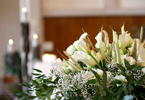 A selection of white flowers, displayed at a funeral